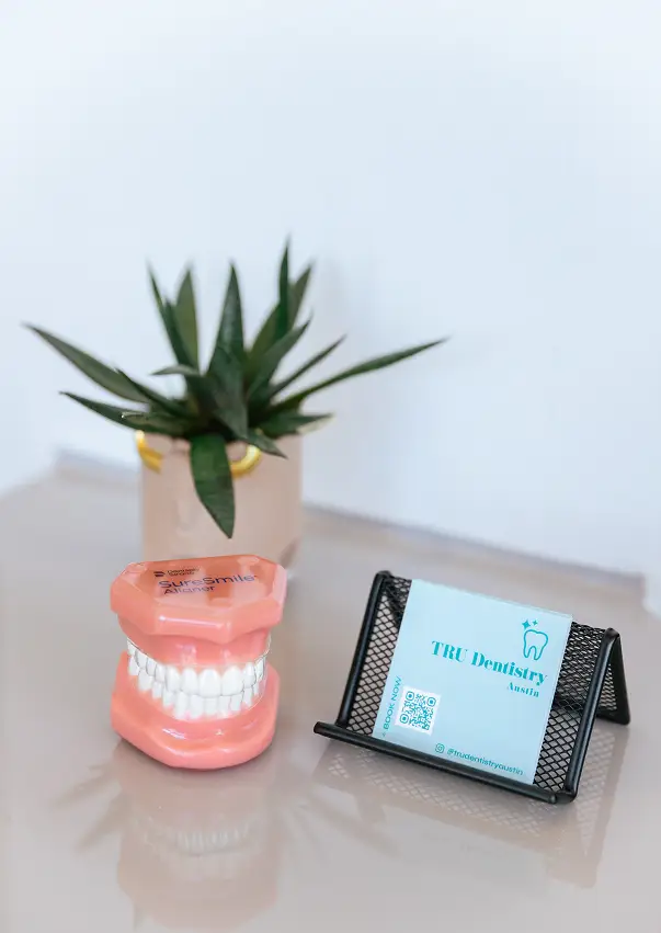 Dental office welcome display with dental model and patient information card at TRU Dentistry SoCo