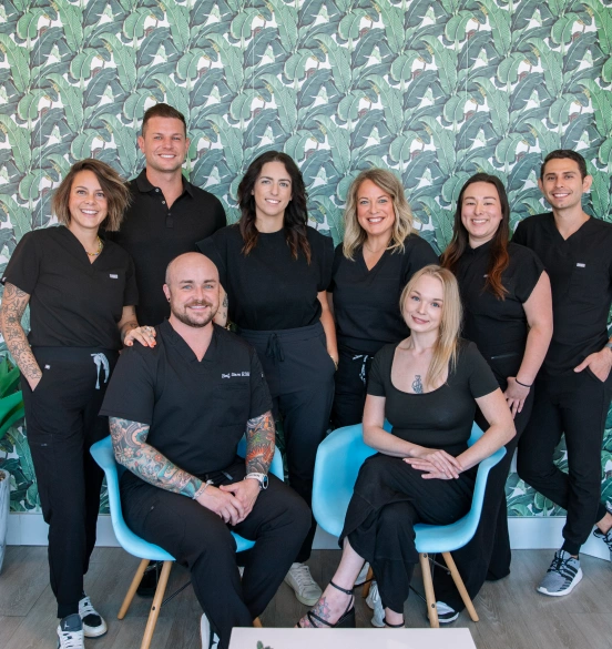 Team photo of the dental staff at TRU Dentistry SoCo providing family dental care in South Austin, TX