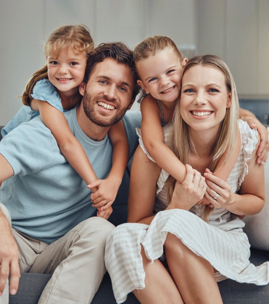 Happy family with young children smiling after a general dentistry visit at TRU Dentistry SoCo in South Austin, TX
