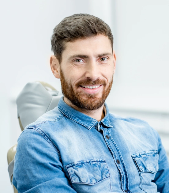 Man smiling in dental chair before periodontal treatment at TRU Dentistry SoCo in South Austin, TX