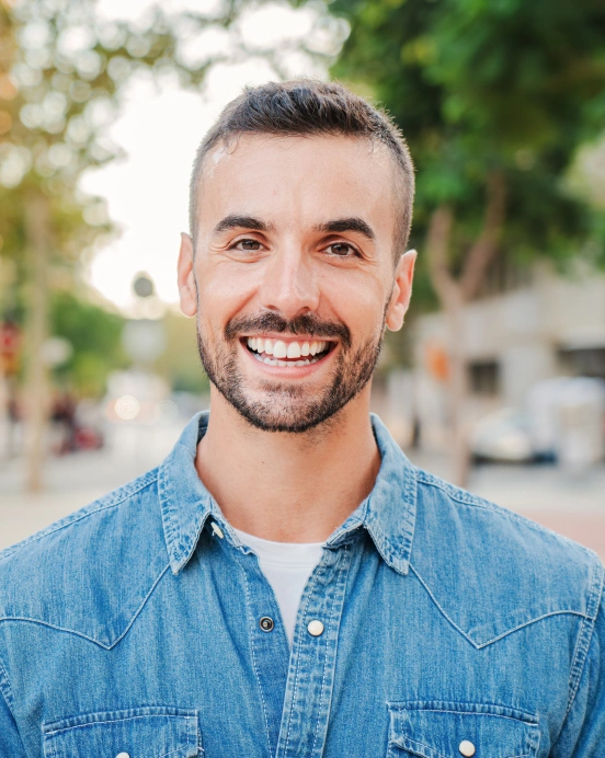 Man with bright white smile after professional teeth whitening at TRU Dentistry SoCo in South Austin, TX