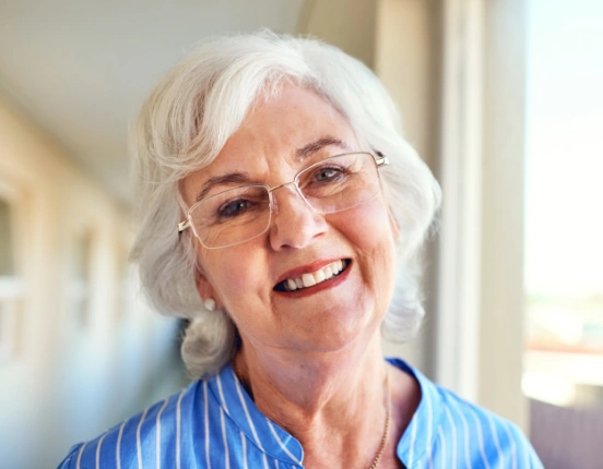 Senior woman smiling after benefiting from the TRU Club membership at TRU Dentistry SoCo in South Austin, TX